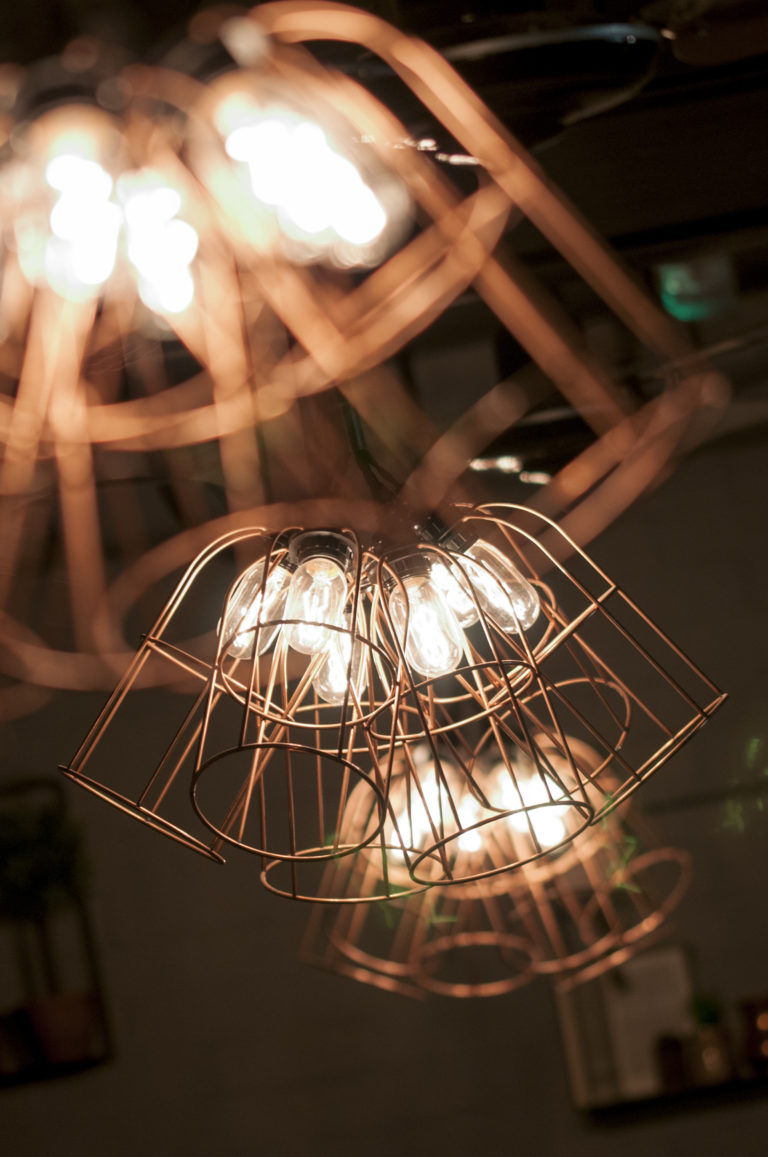 Clusters of LED bulbs with wire cages around each one. Interior Photography | London Interior Photographer | David Chatfield Photography