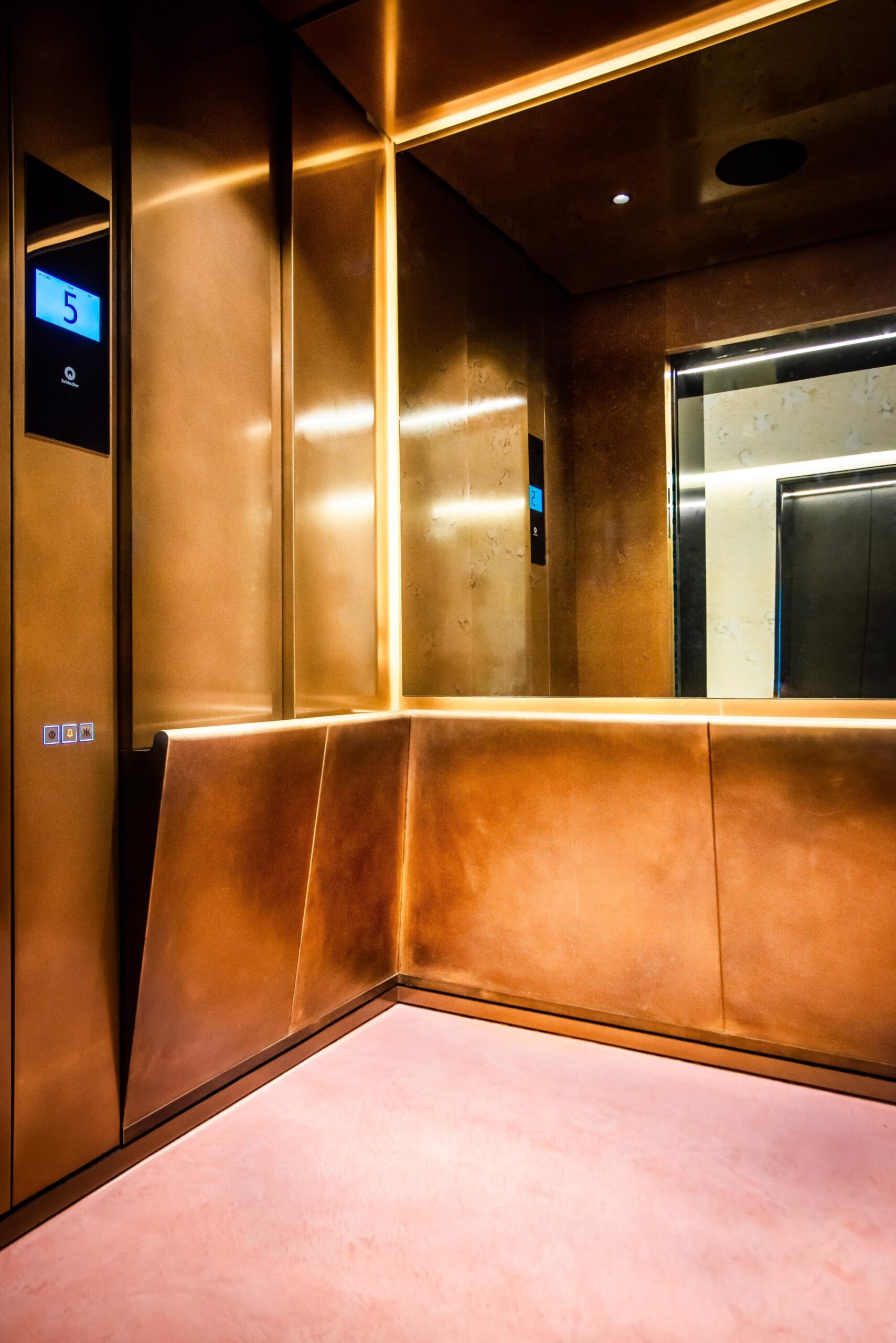 Elevator with a Bronze metal interior