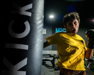 Fighter punching a punch bag