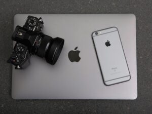 Picture of a mobile phon a camera and a laptop